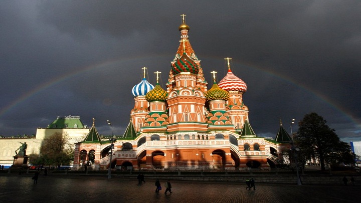 ** FILE ** In this Oct. 10, 2007 file photo, St. Basil Cathedral is lit by the sun with a rainbow in the background on Red Square in Moscow. Moscow is the world's most expensive town for foreign business people, according to a list published by US consulting Mercer on Thursday July 24, 2008.   (AP Photo/Alexander Zemlianichenko)