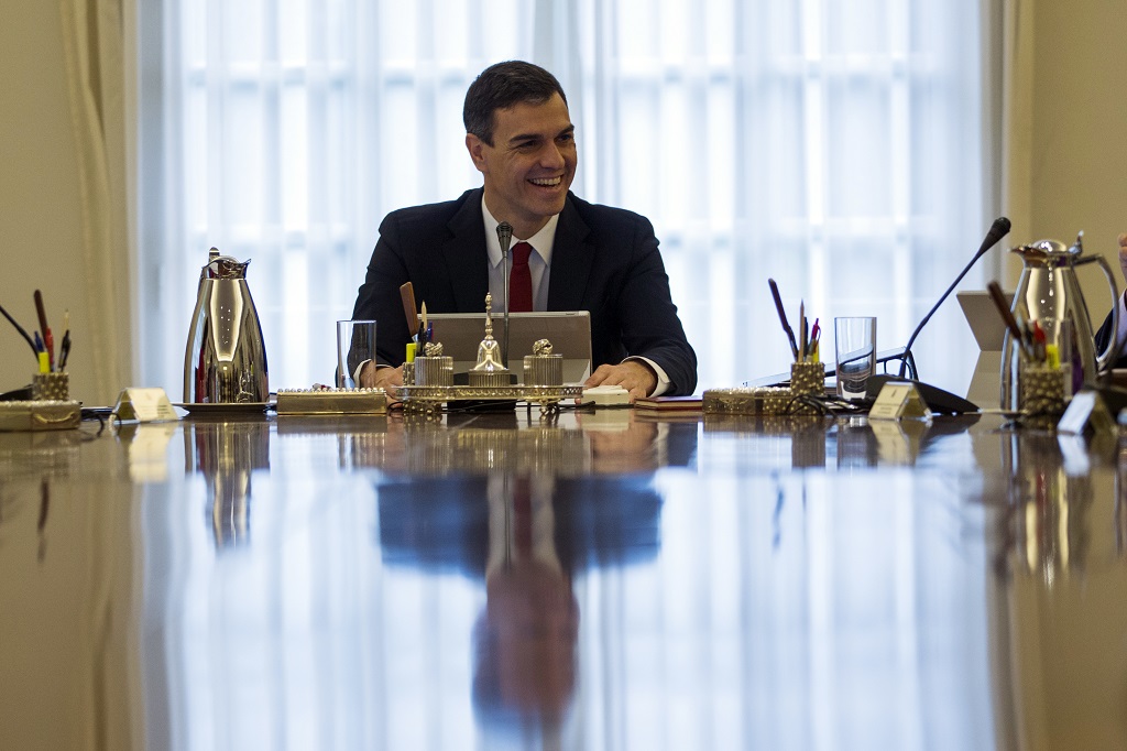 Spain's new Prime Minister Pedro Sanchez, centre, cmiles during the first Cabinet meeting of the new government at the Moncloa palace in Madrid, Friday, June 8, 2018. (AP Photo/Francisco Seco)