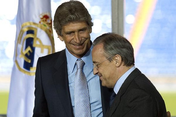 Real Madrid football club's new coach Manuel Pellegrini (L) of Chile chats with President Florentino Perez at Santiago Bernabeu stadium in Madrid on June 2, 2009. Pellegrini will be under pressure to achieve some early success for new president Florentino Perez, who has vowed to build the "best club of the 21st century." The Chilean, 55, a qualified civil engineer, replaced Juande Ramos on June 1 as Real's seventh manager in the past decade. AFP PHOTO/ PIERRE-PHILIPPE MARCOU