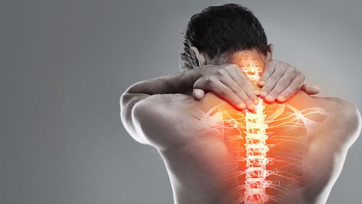 QwgW0-a-man-holding-his-back-which-is-glowing-in-pain