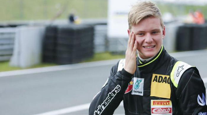 Van Ammersfoort Formula Four driver Mick Schumacher of Germany smiles as he leaves the pitlane after the second race of the ADAC F4 season at the Motorsport Arena in Oschersleben, Germany, April 26, 2015.  REUTERS/Hannibal Hanschke