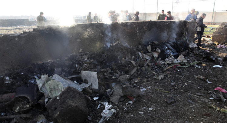 epa08112157 A view of the wreckage after an Ukraine International Airlines Boeing 737-800 carrying 176 people crashed near Imam Khomeini Airport in Tehran, killing everyone on board, in Shahriar, Iran, 08 January 2020.  EPA-EFE/ABEDIN TAHERKENAREH