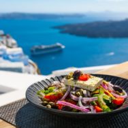 Greek,Salad,With,Beautiful,Sea,View,In,Santorini,Island,,Greece.
