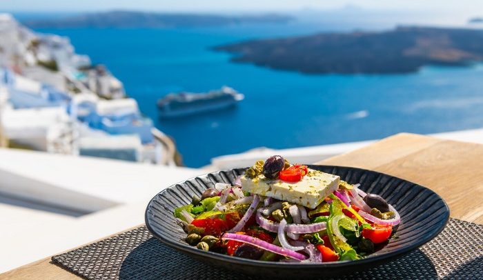Greek,Salad,With,Beautiful,Sea,View,In,Santorini,Island,,Greece.